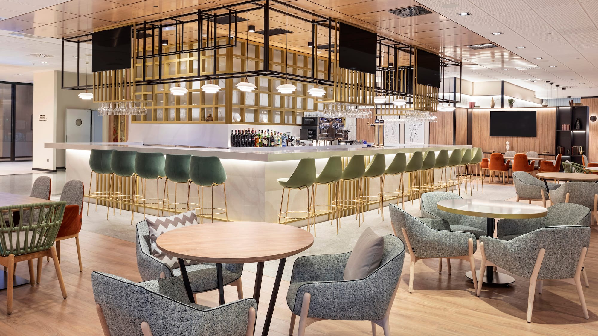 a room with a bar and chairs