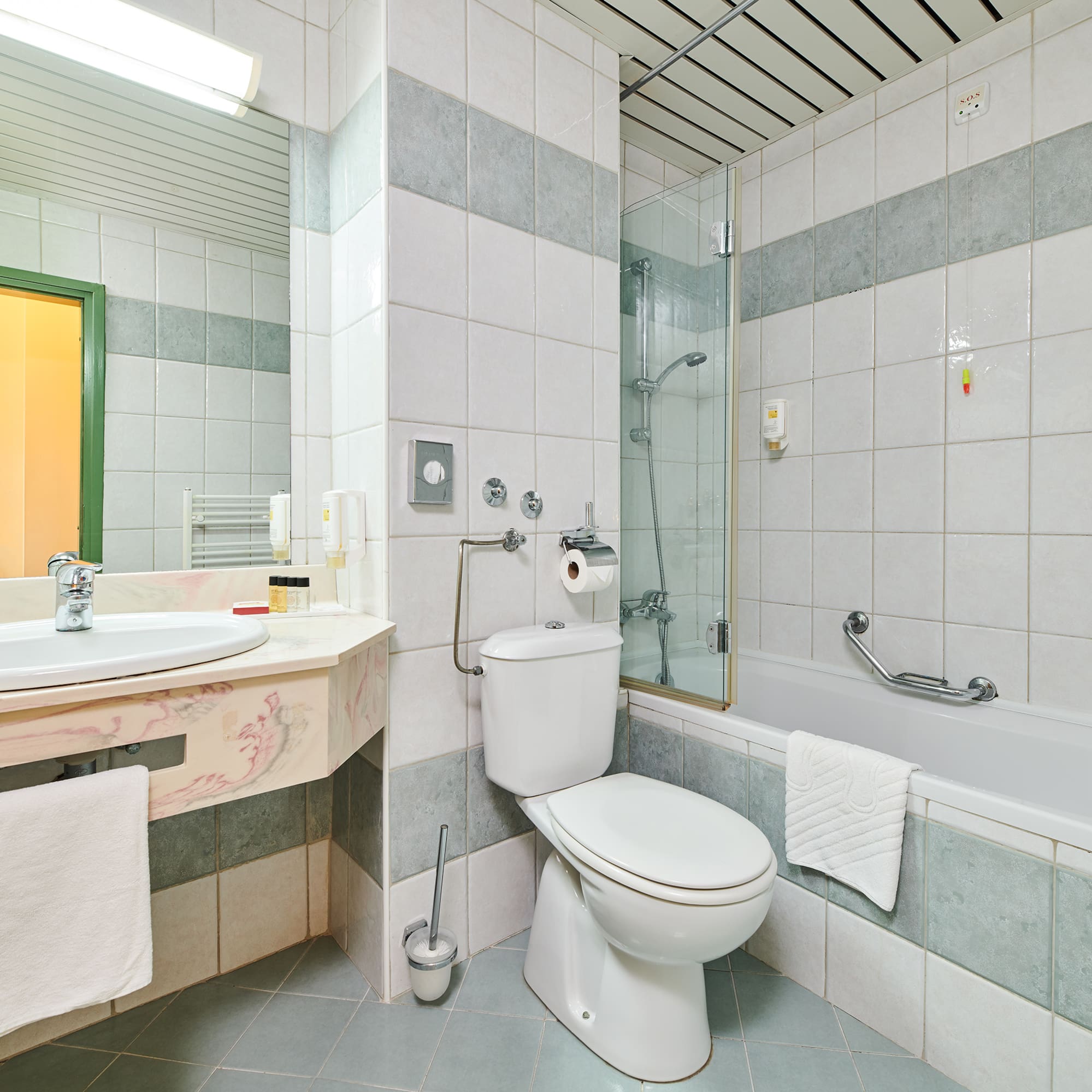 a bathroom with a toilet and tub