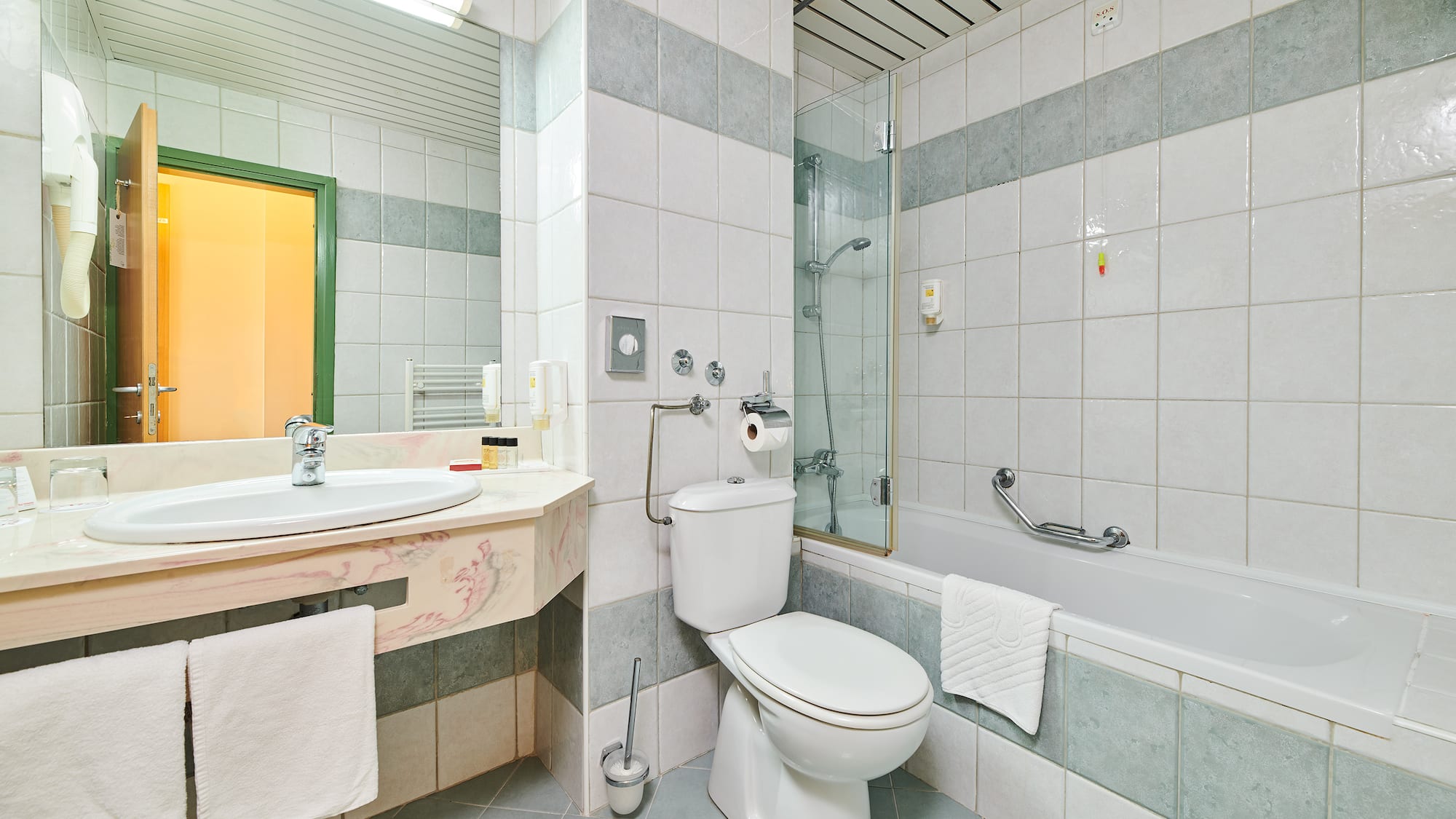 a bathroom with a toilet and tub