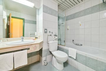a bathroom with a toilet and tub