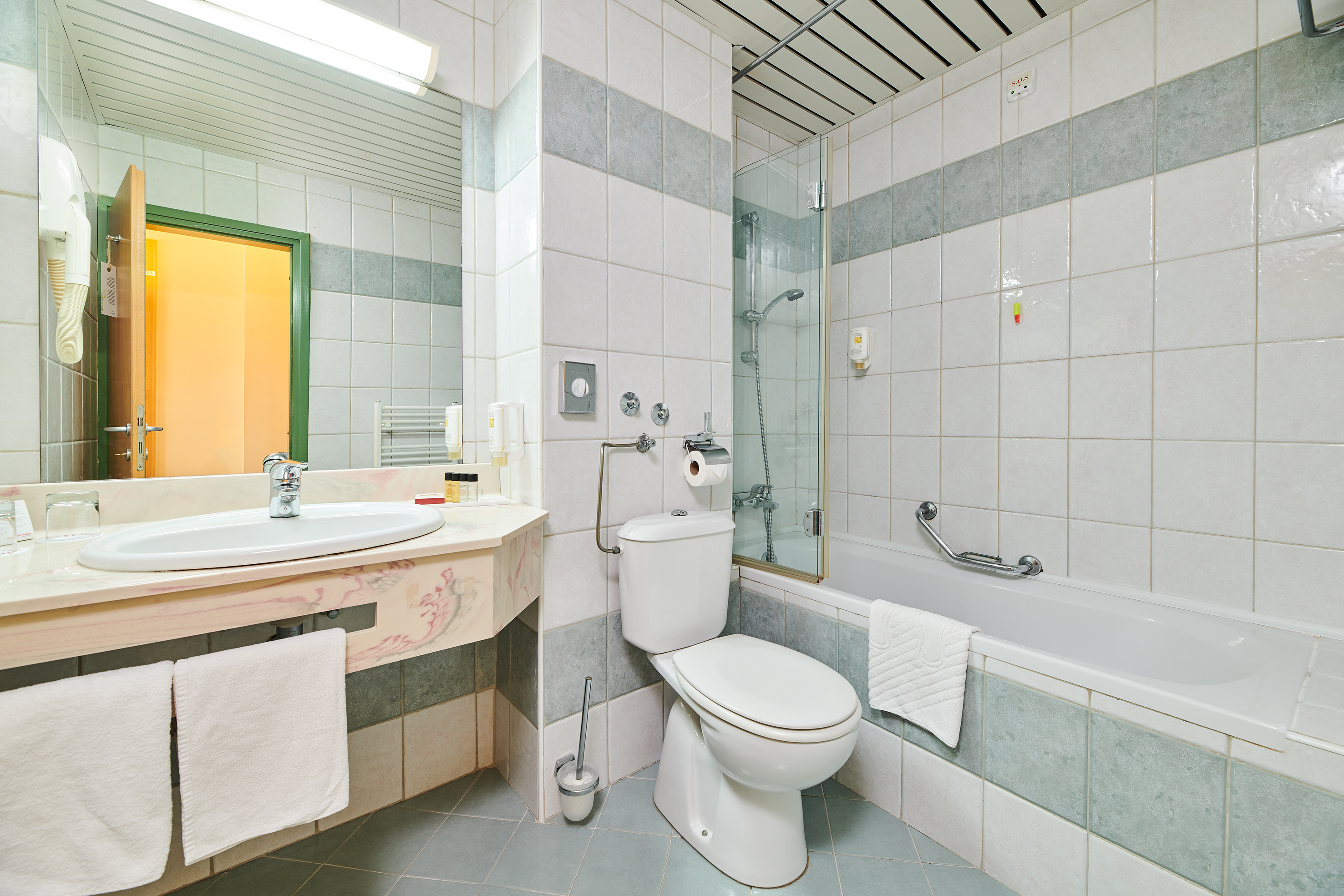 a bathroom with a toilet and tub