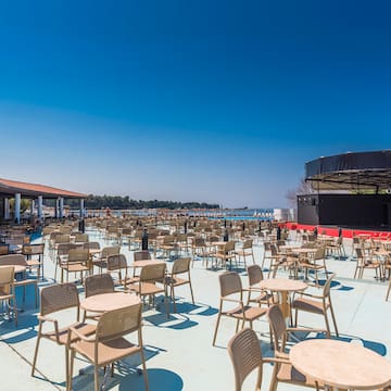 a large outdoor restaurant with tables and chairs