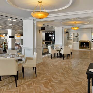 a room with white furniture and a fireplace