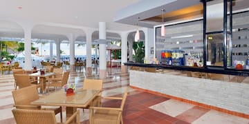 a restaurant with tables and chairs