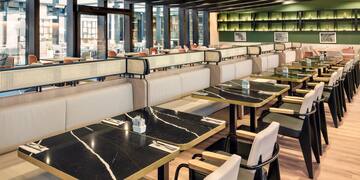 a restaurant with tables and chairs