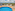 Rooftop swimming pool deck with lounge chairs, blue umbrella, and city view.