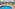Hotel rooftop pool with lounge chairs, blue umbrella, and city view.