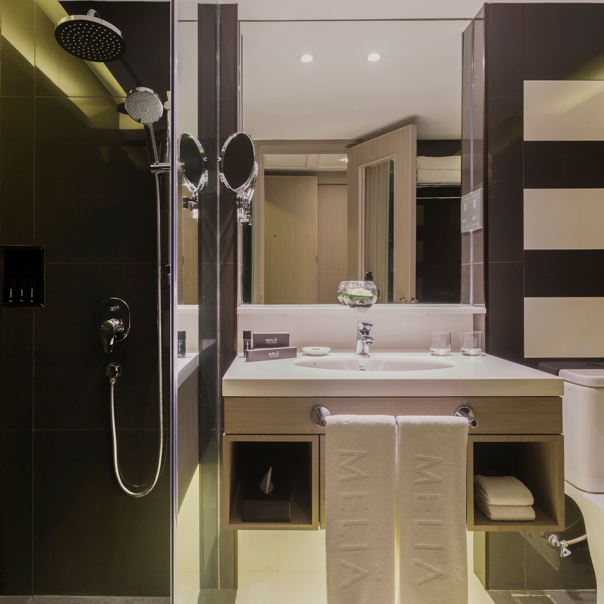 a bathroom with a shower and sink