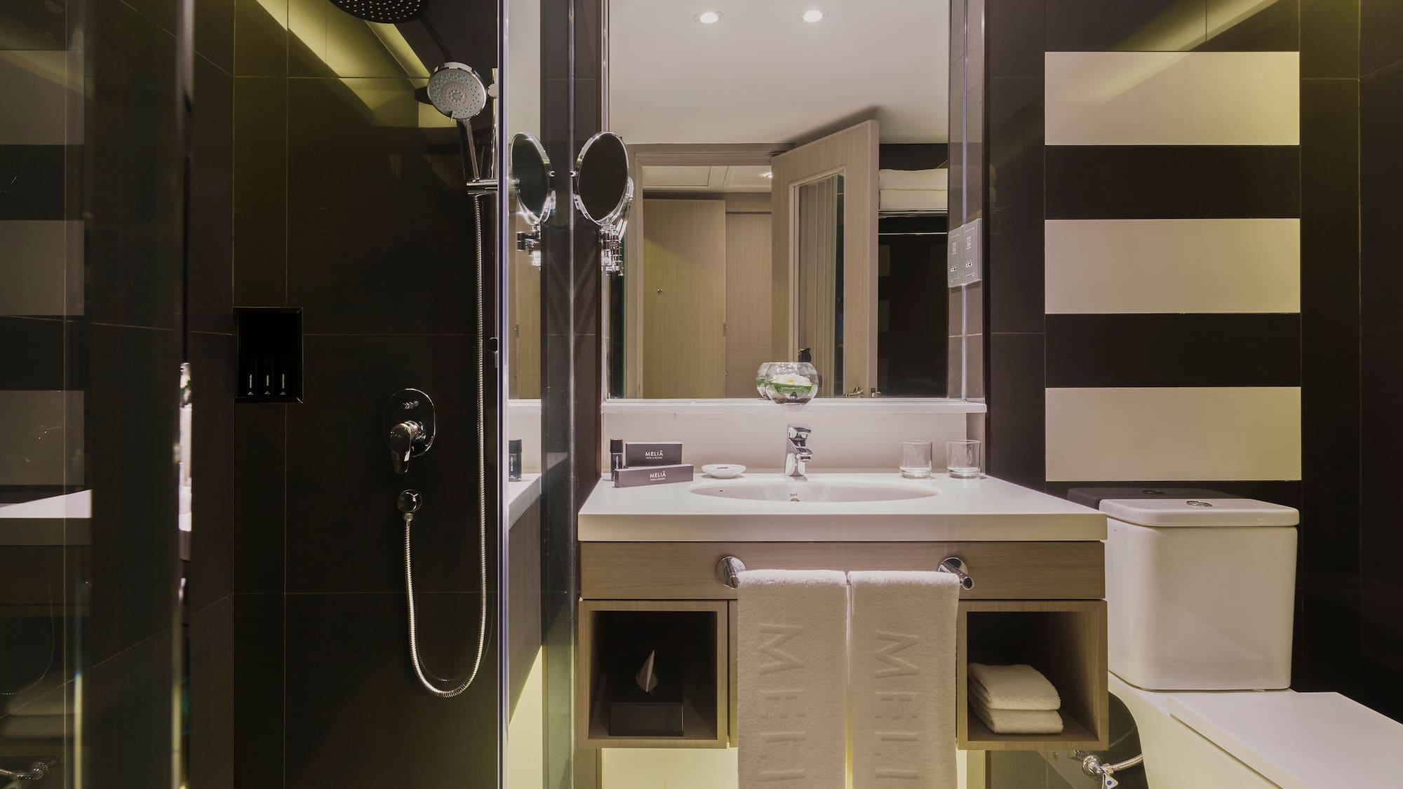 a bathroom with a shower and sink