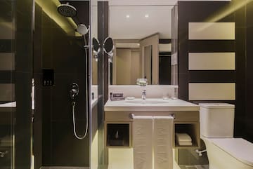 a bathroom with a shower and sink