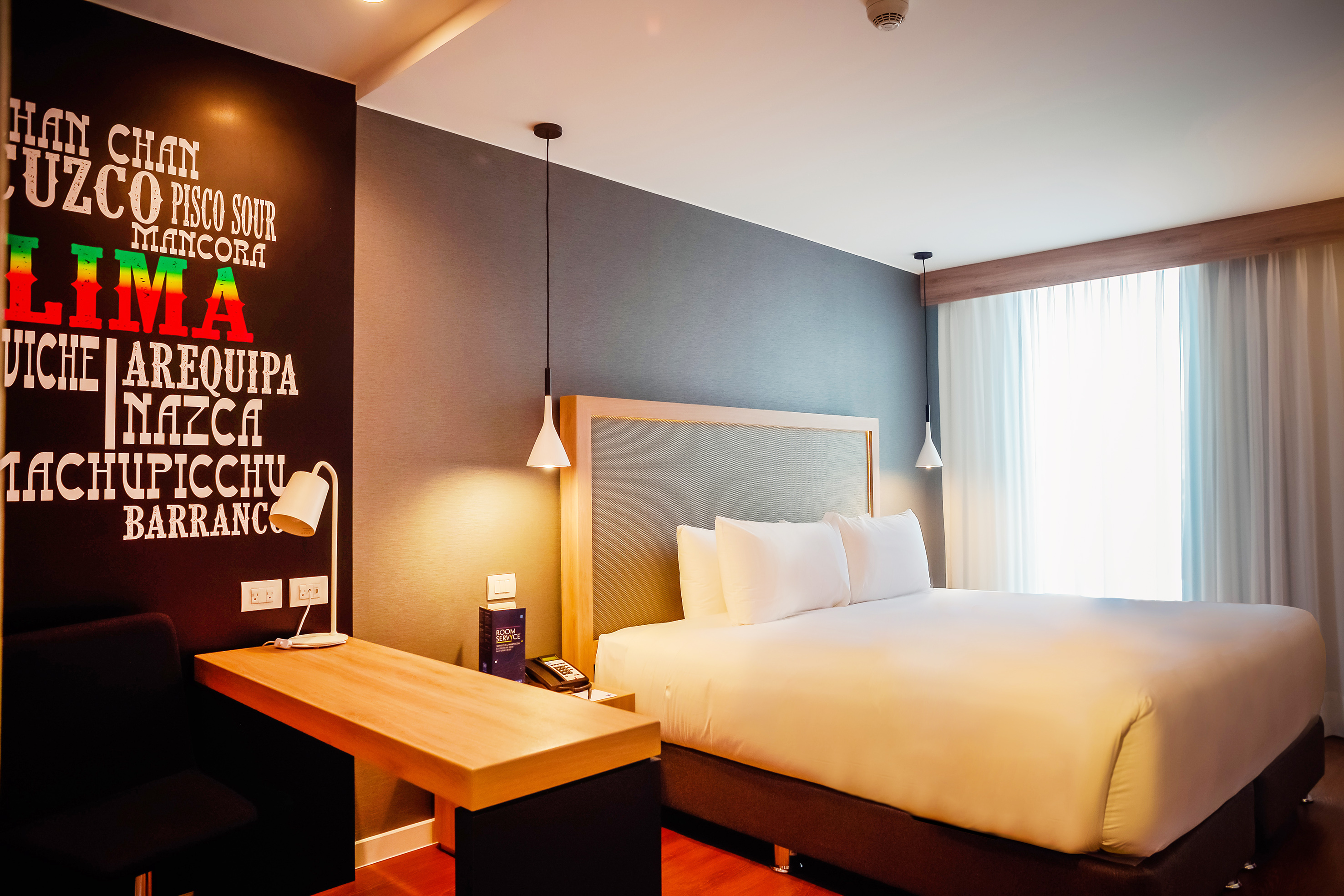 a room with a bed and a desk