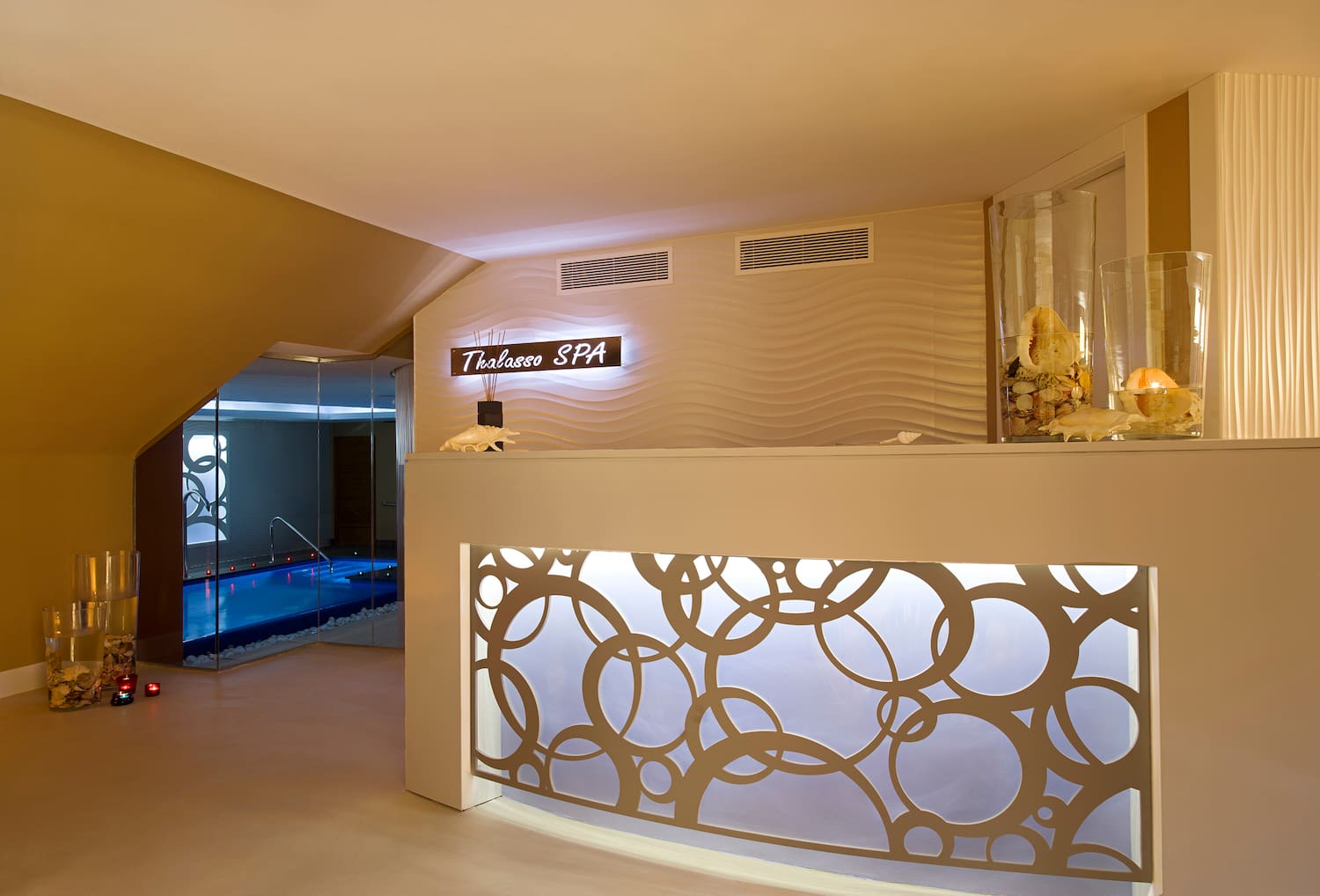 a spa reception area with a pool