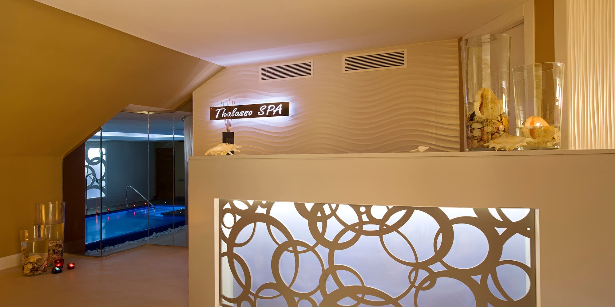 a spa reception area with a pool