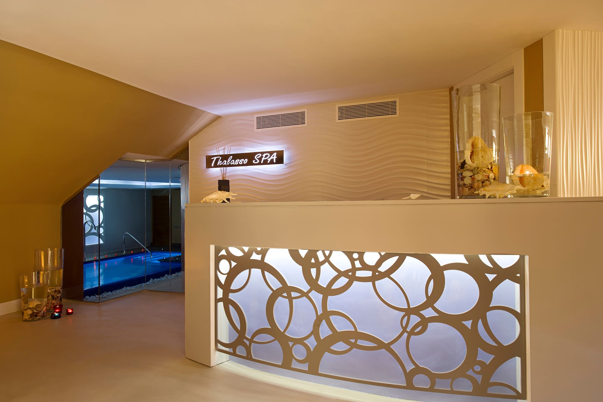 a spa reception area with a pool