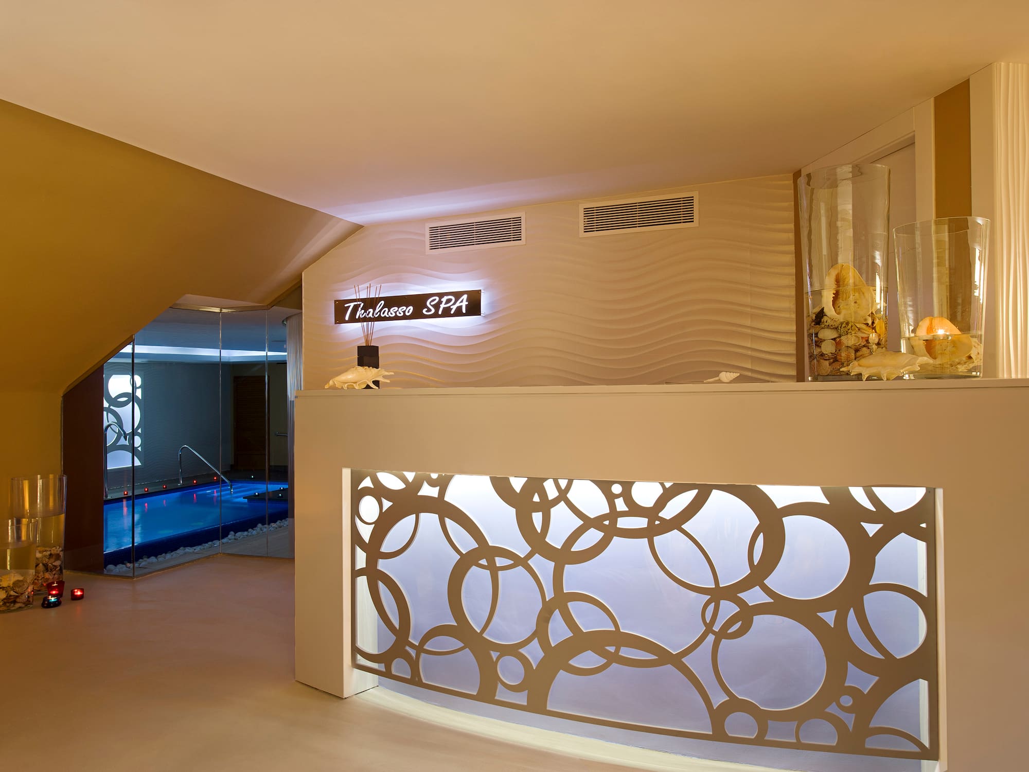a spa reception area with a pool