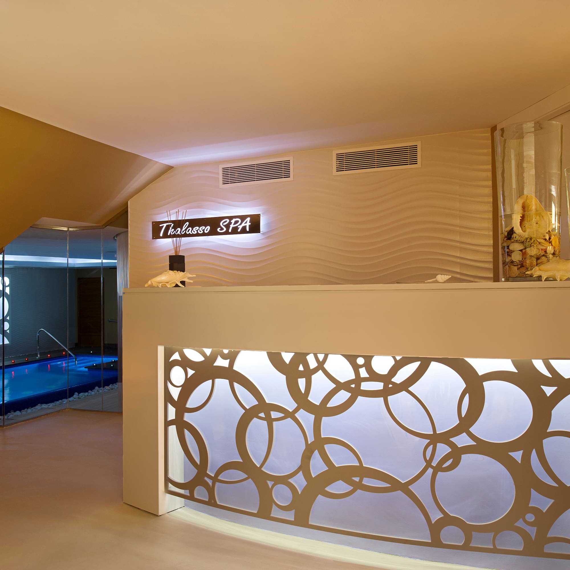 a spa reception area with a pool
