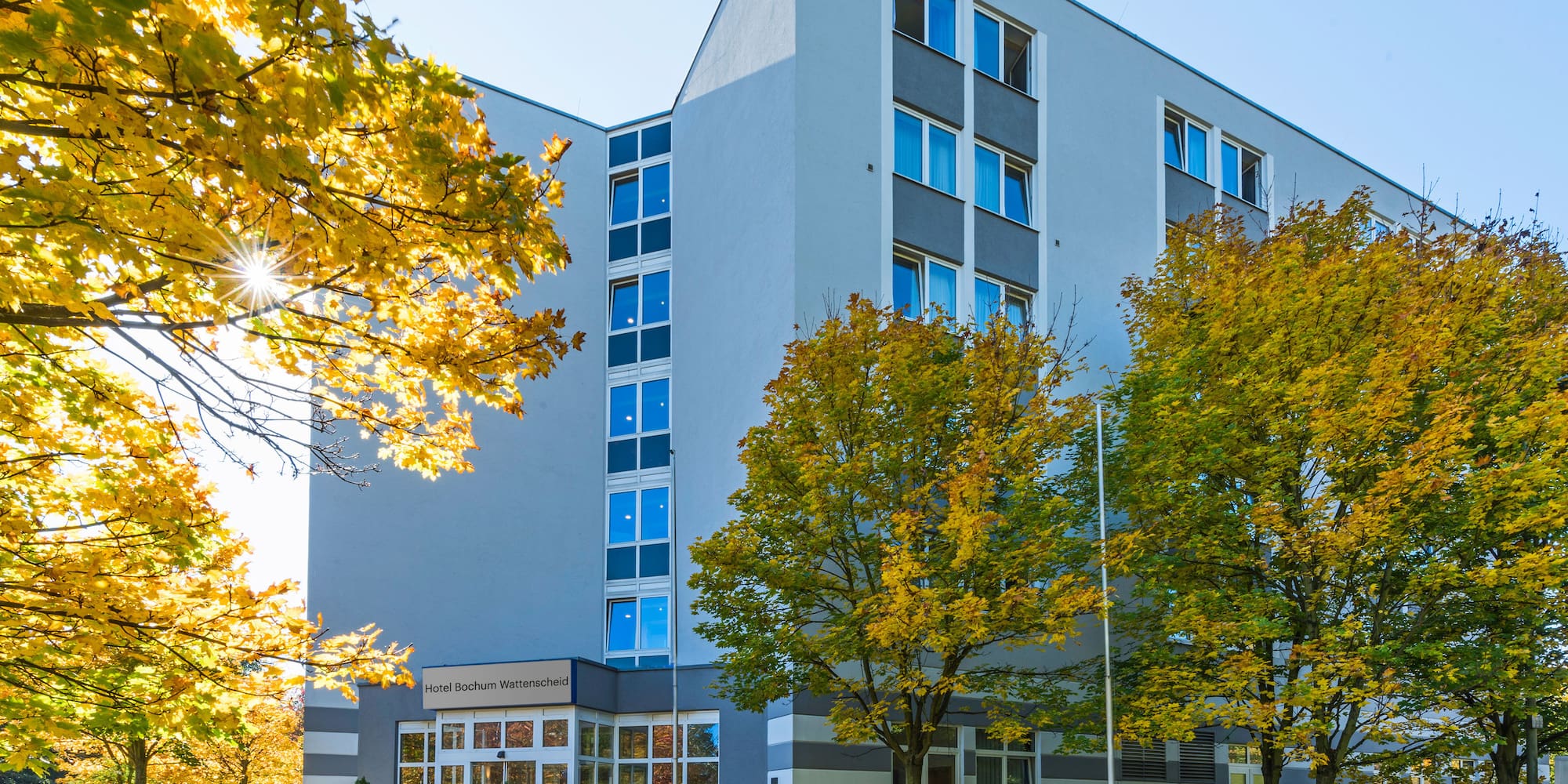 a building with trees in front of it
