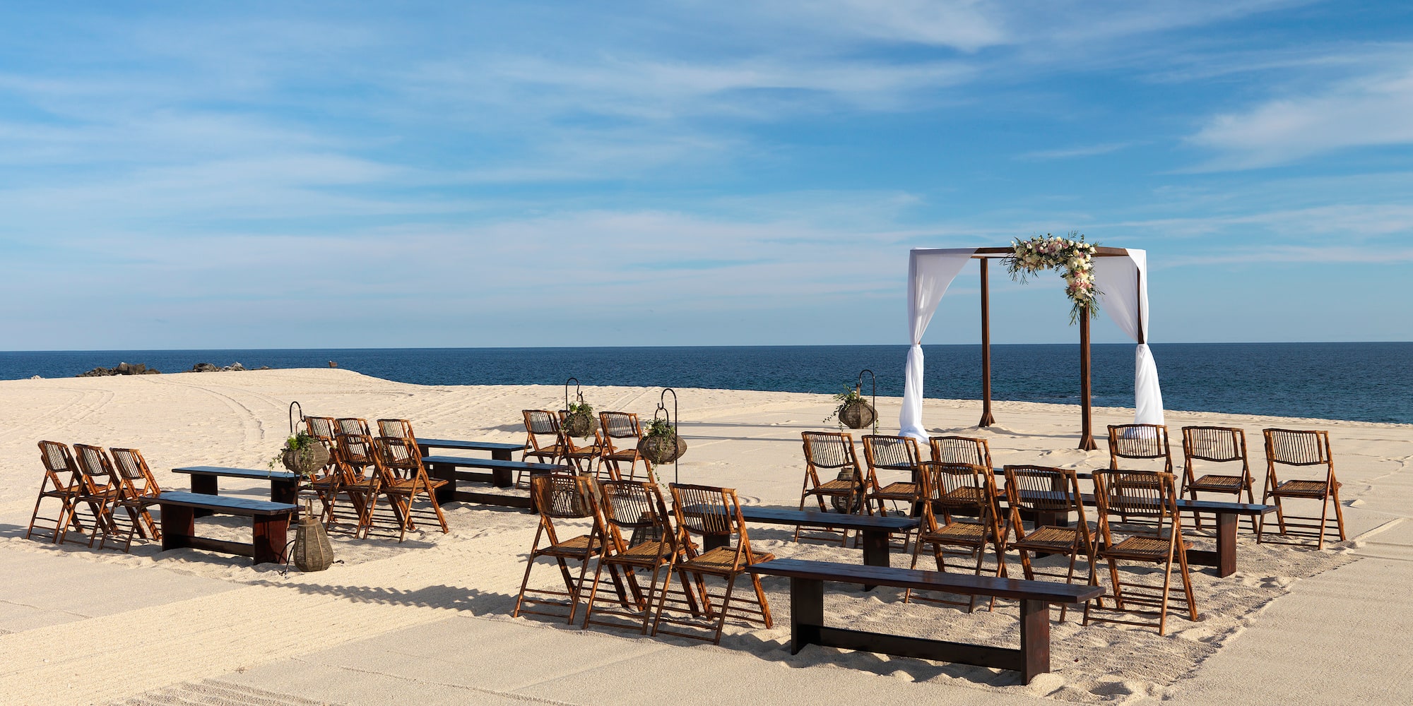chairs and benches on a beach