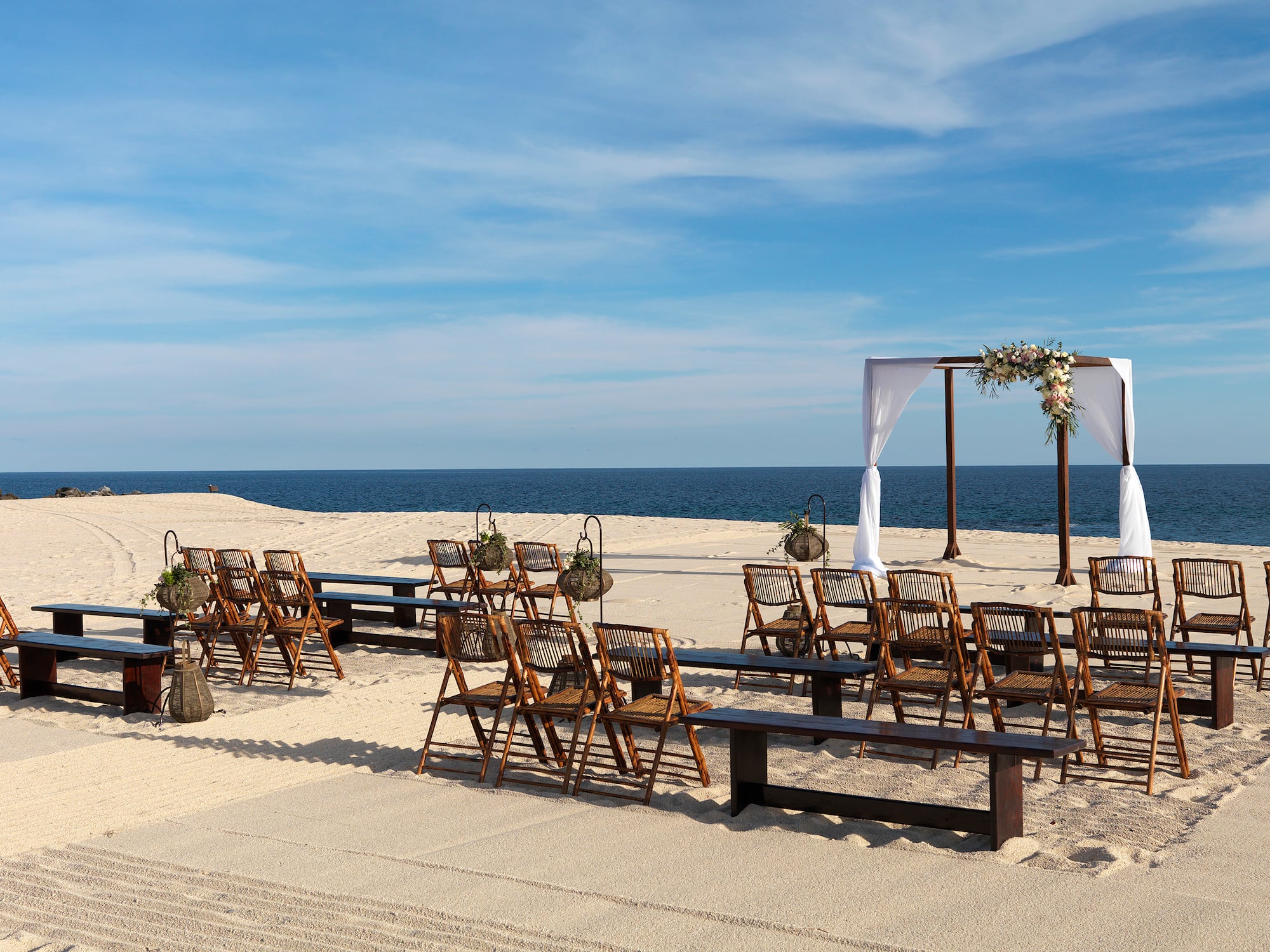 chairs and benches on a beach