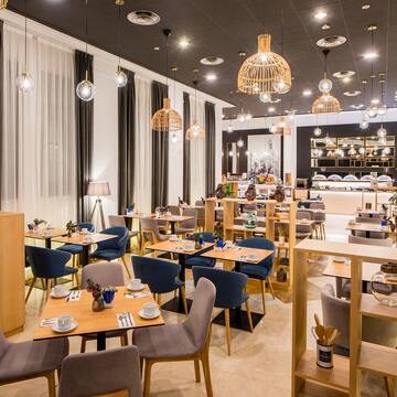 a restaurant with tables and chairs