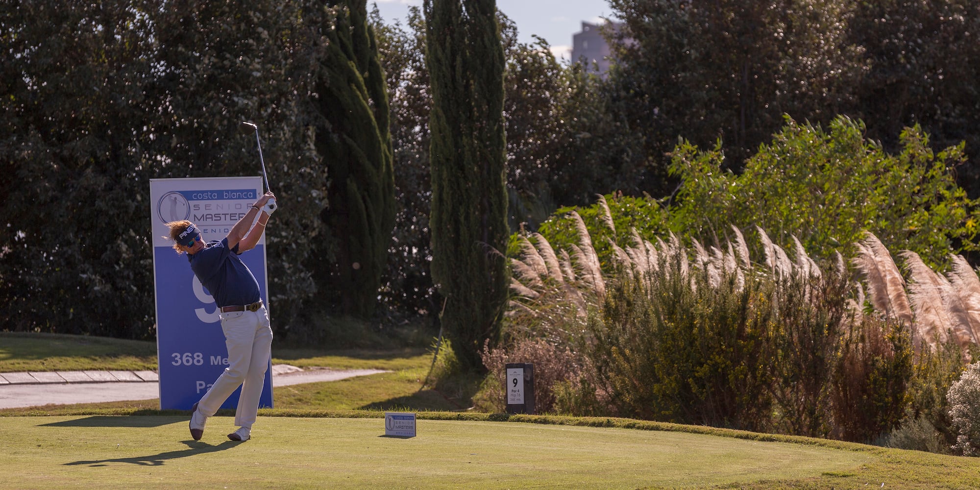 a man swinging a golf club