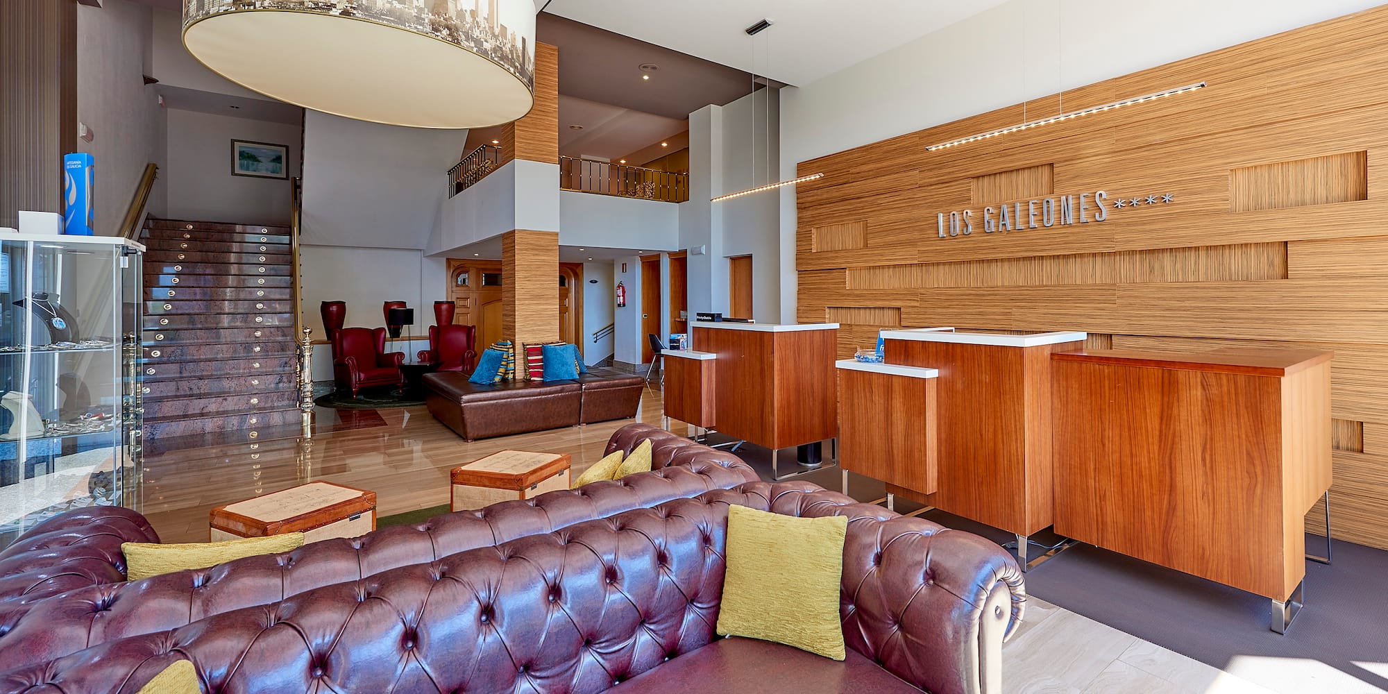 a lobby with a couch and a desk