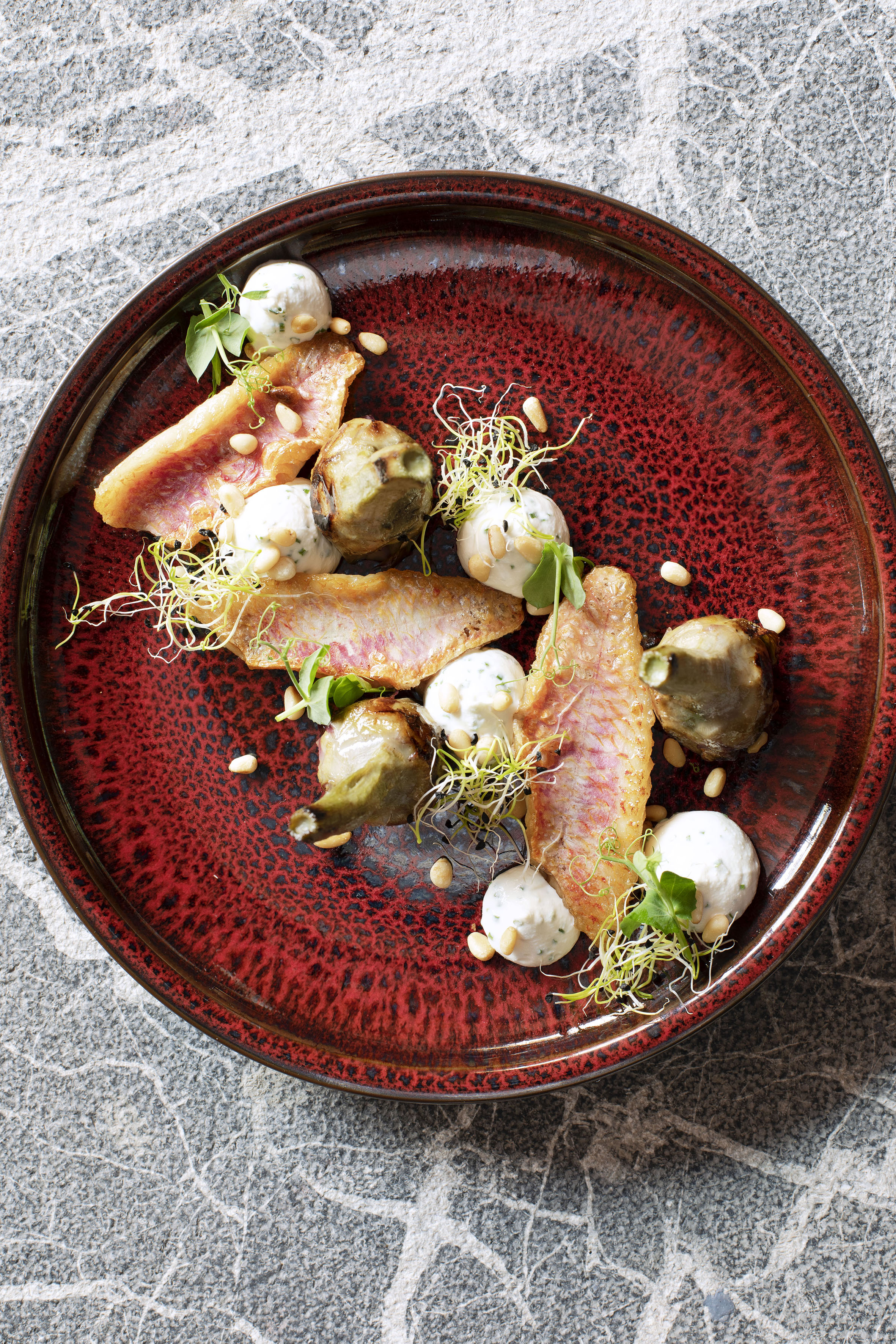 a plate of food on a marbled surface