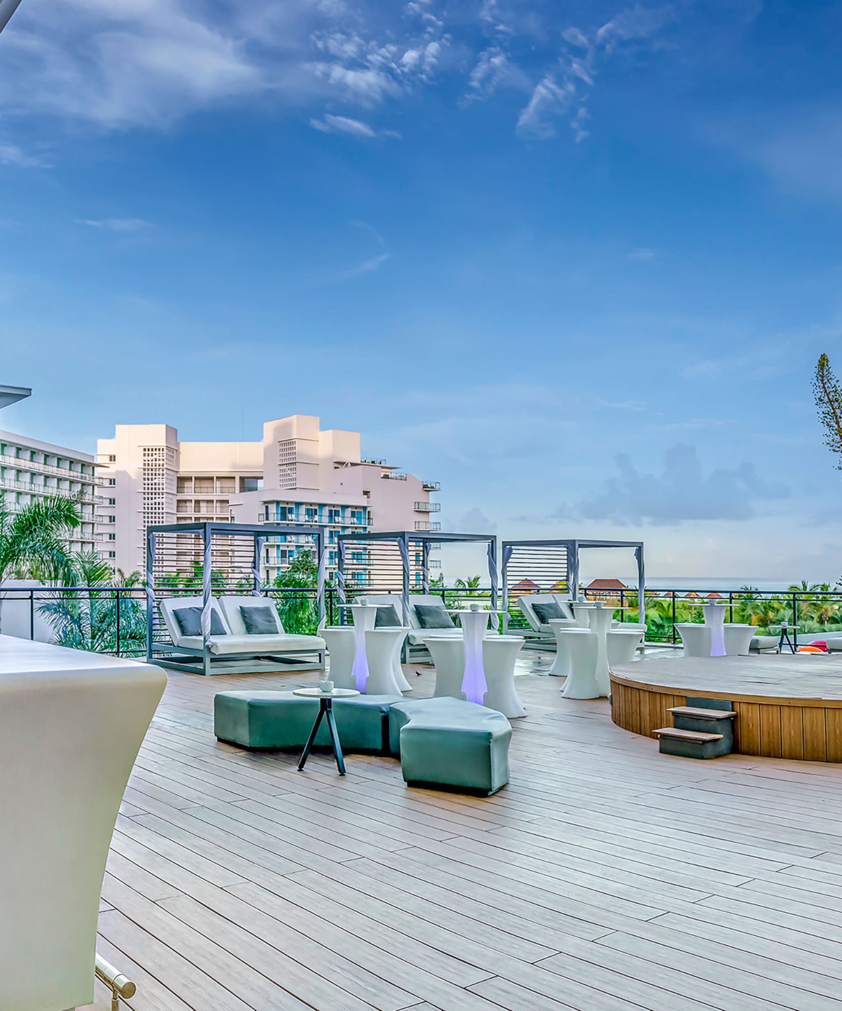 a deck with a pool and chairs