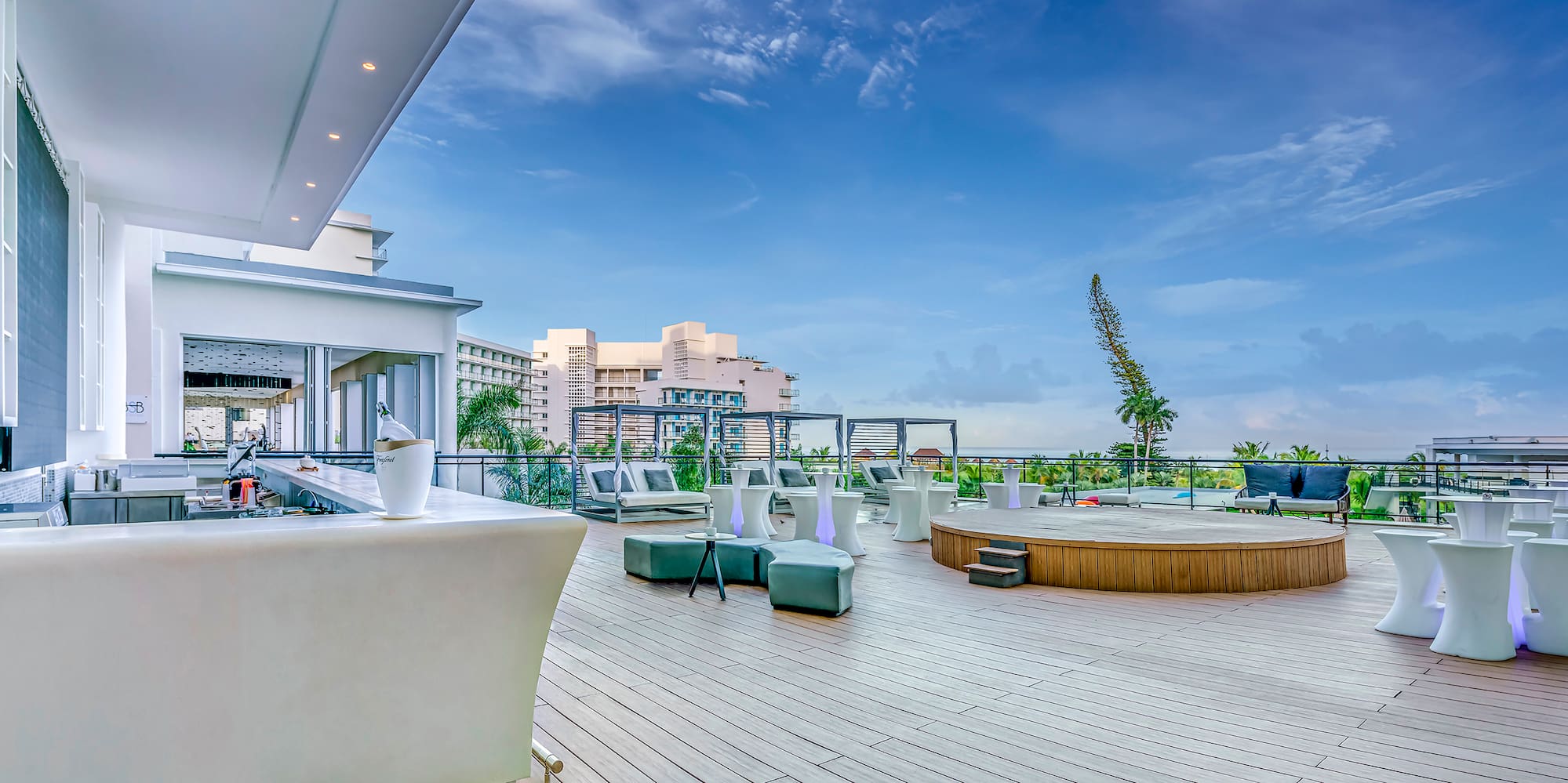 a deck with a pool and chairs