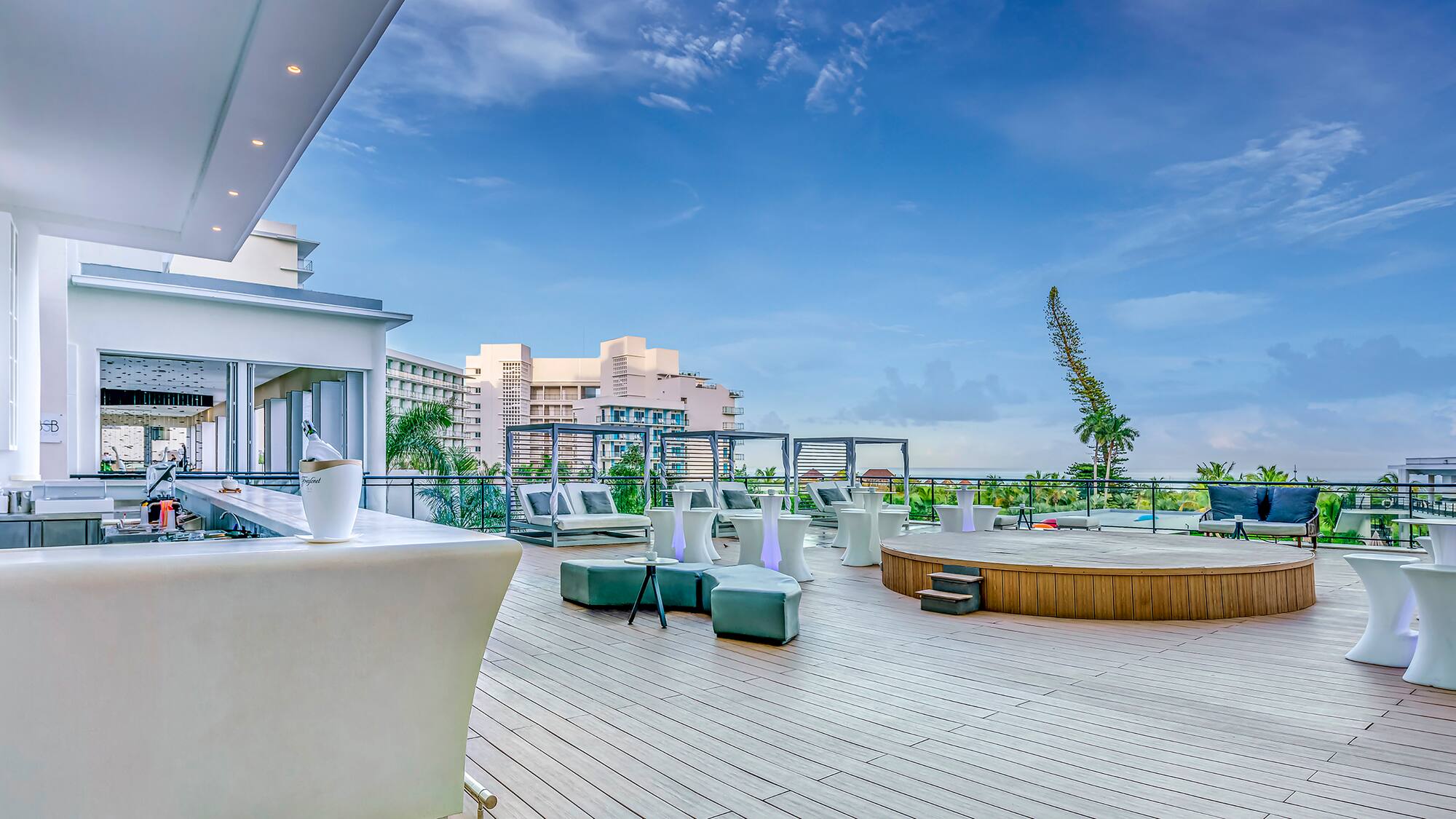 a deck with a pool and chairs