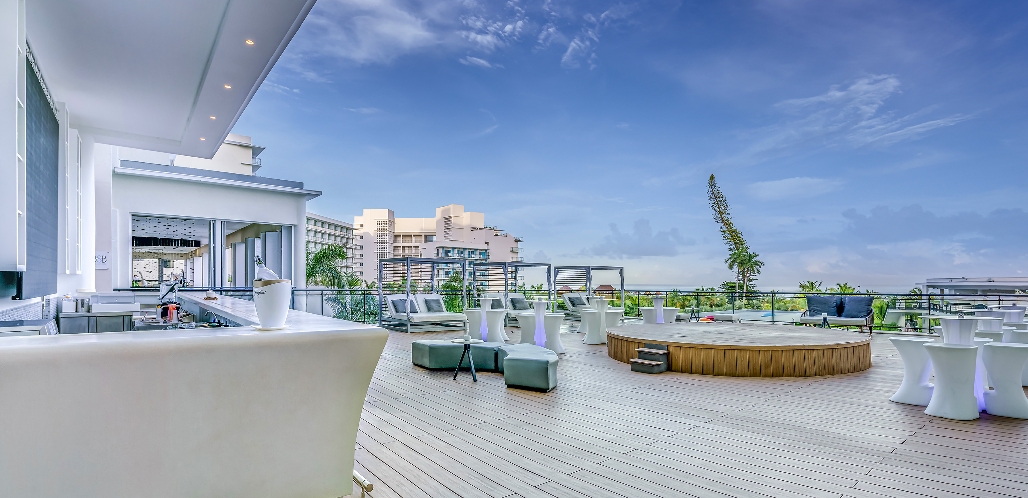 a deck with a pool and chairs