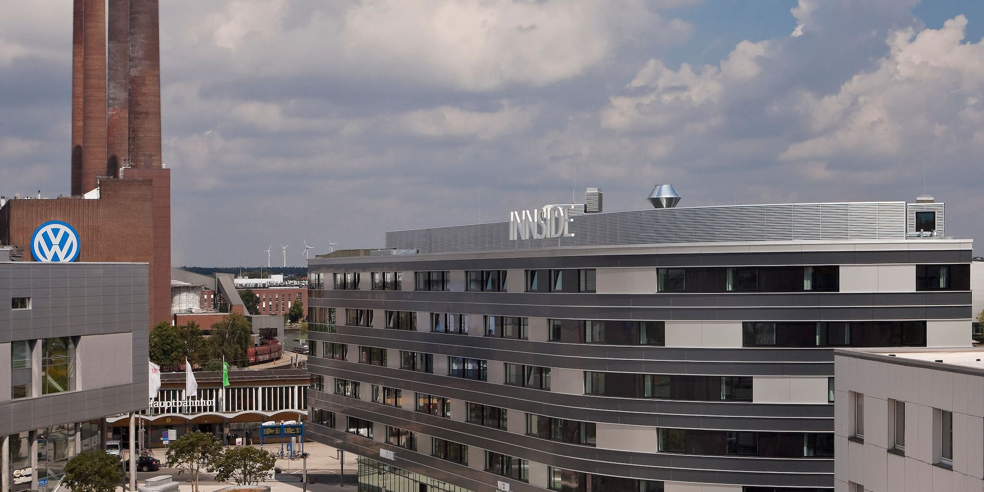 Innside hotel, Volkswagen factory, and industrial smokestacks, Wolfsburg.