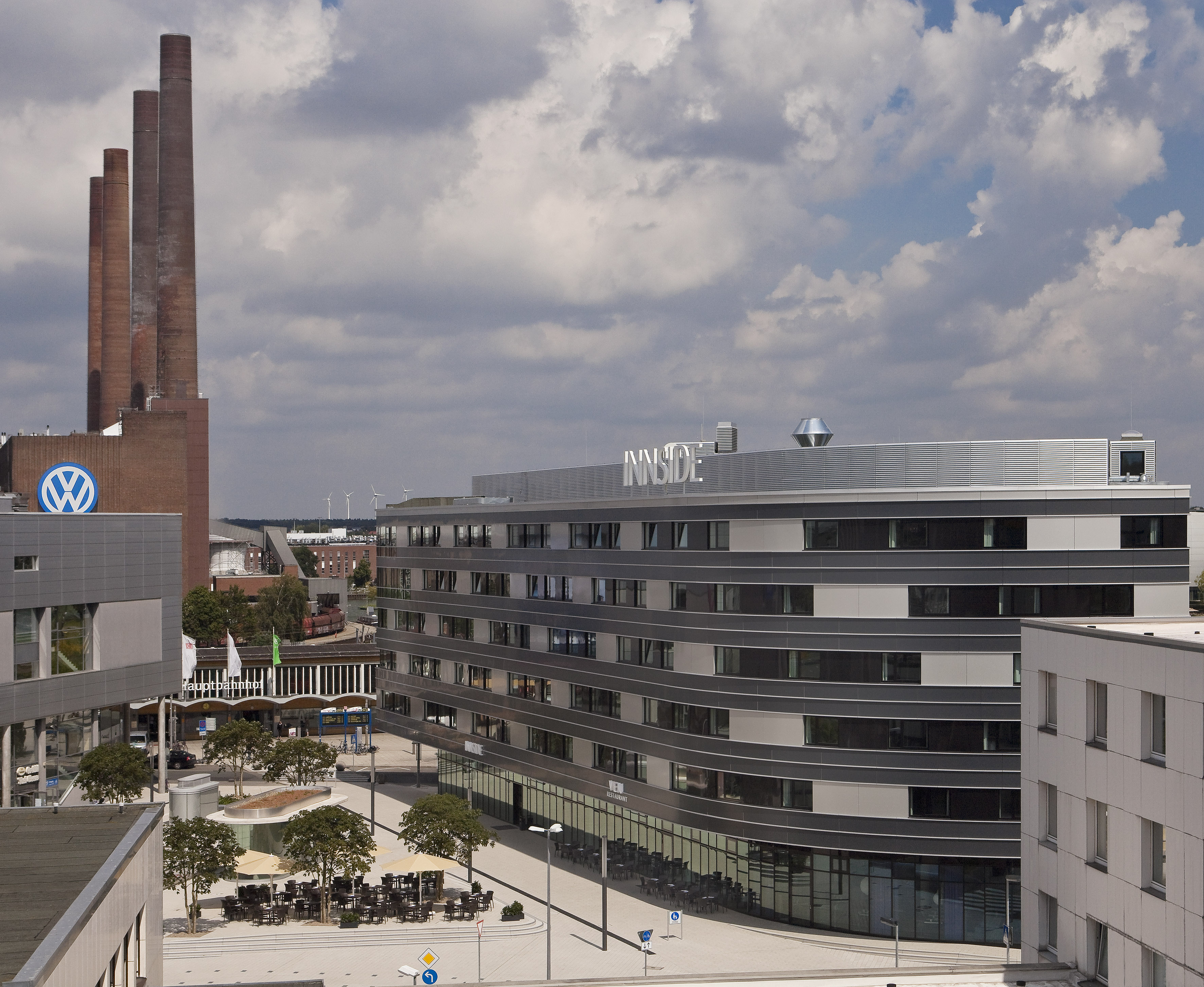Innside hotel, Volkswagen factory, and industrial smokestacks, Wolfsburg.