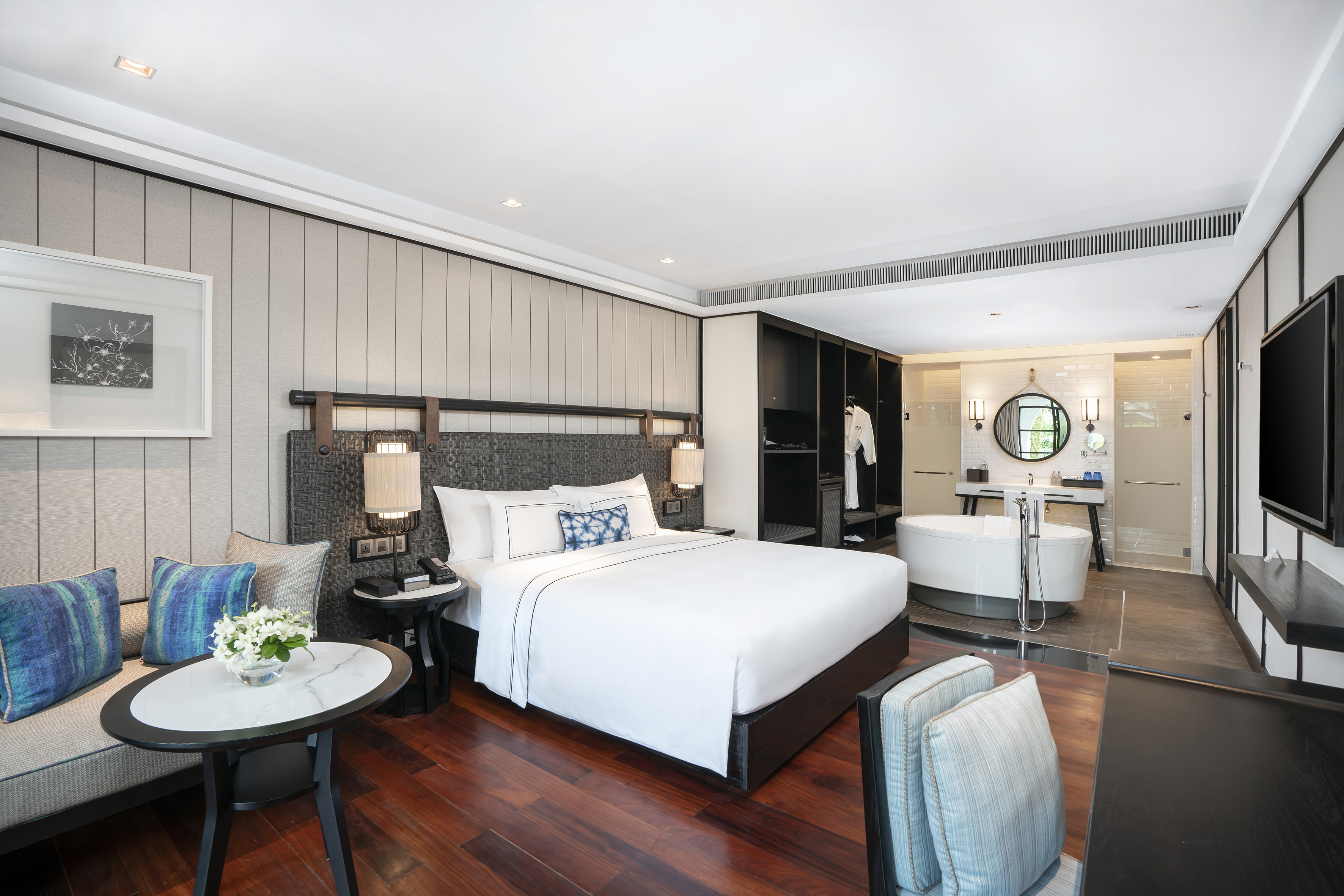 a room with a bed and a tub