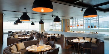 a restaurant with tables and chairs