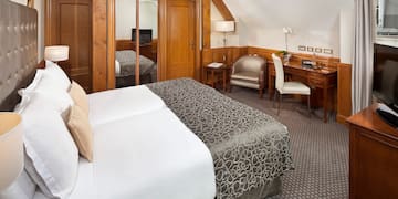 a bedroom with a bed and a desk