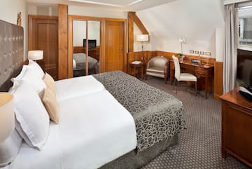 a bedroom with a bed and a desk