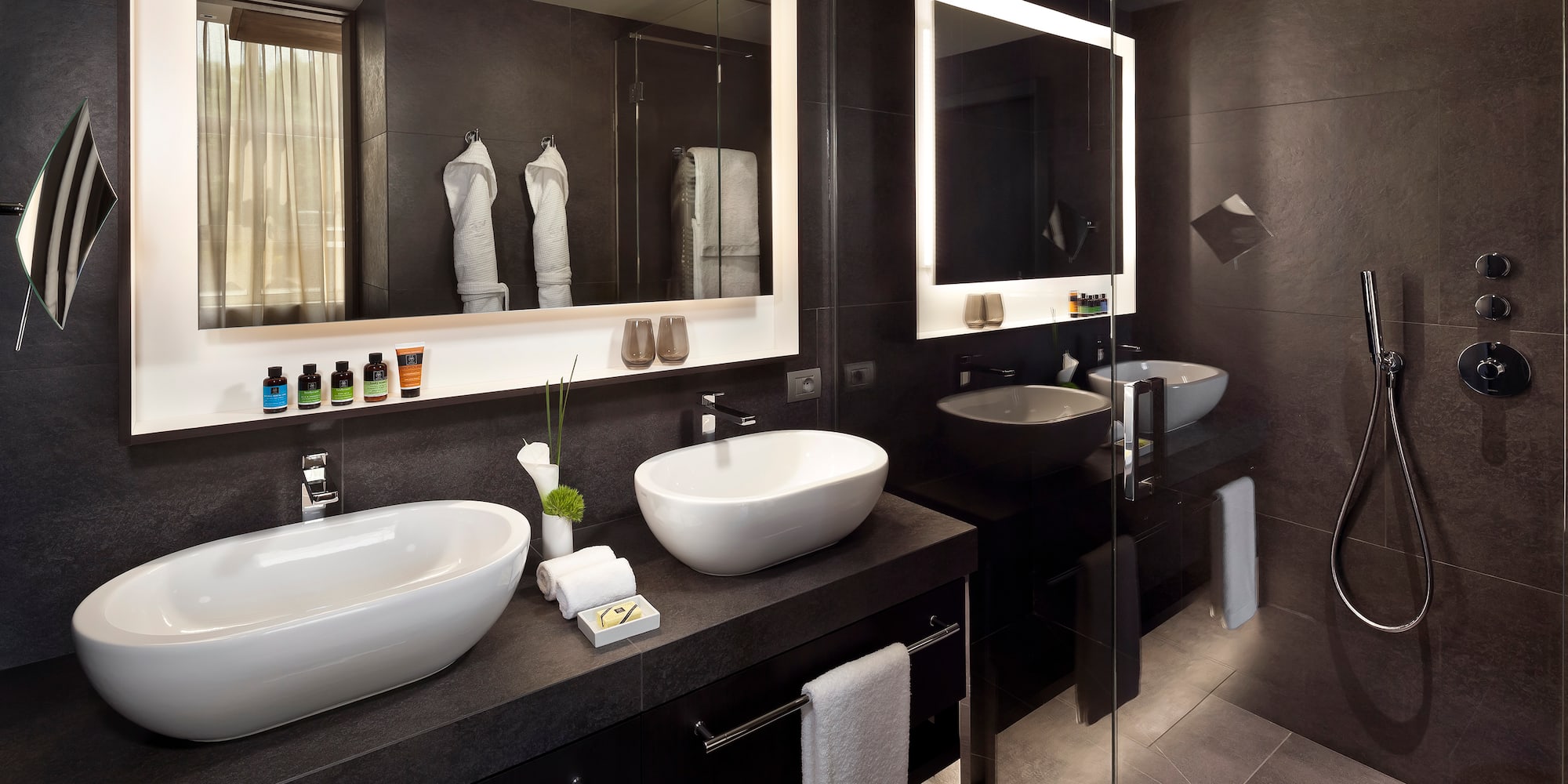 a bathroom with two sinks and a mirror