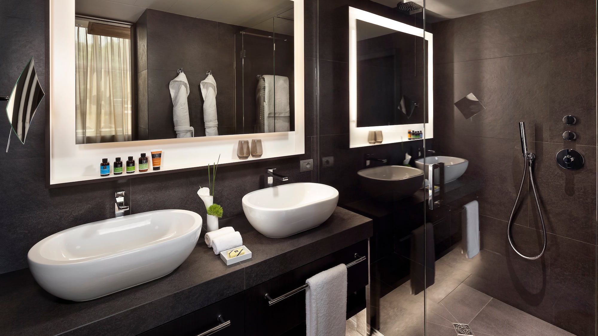 a bathroom with two sinks and a mirror