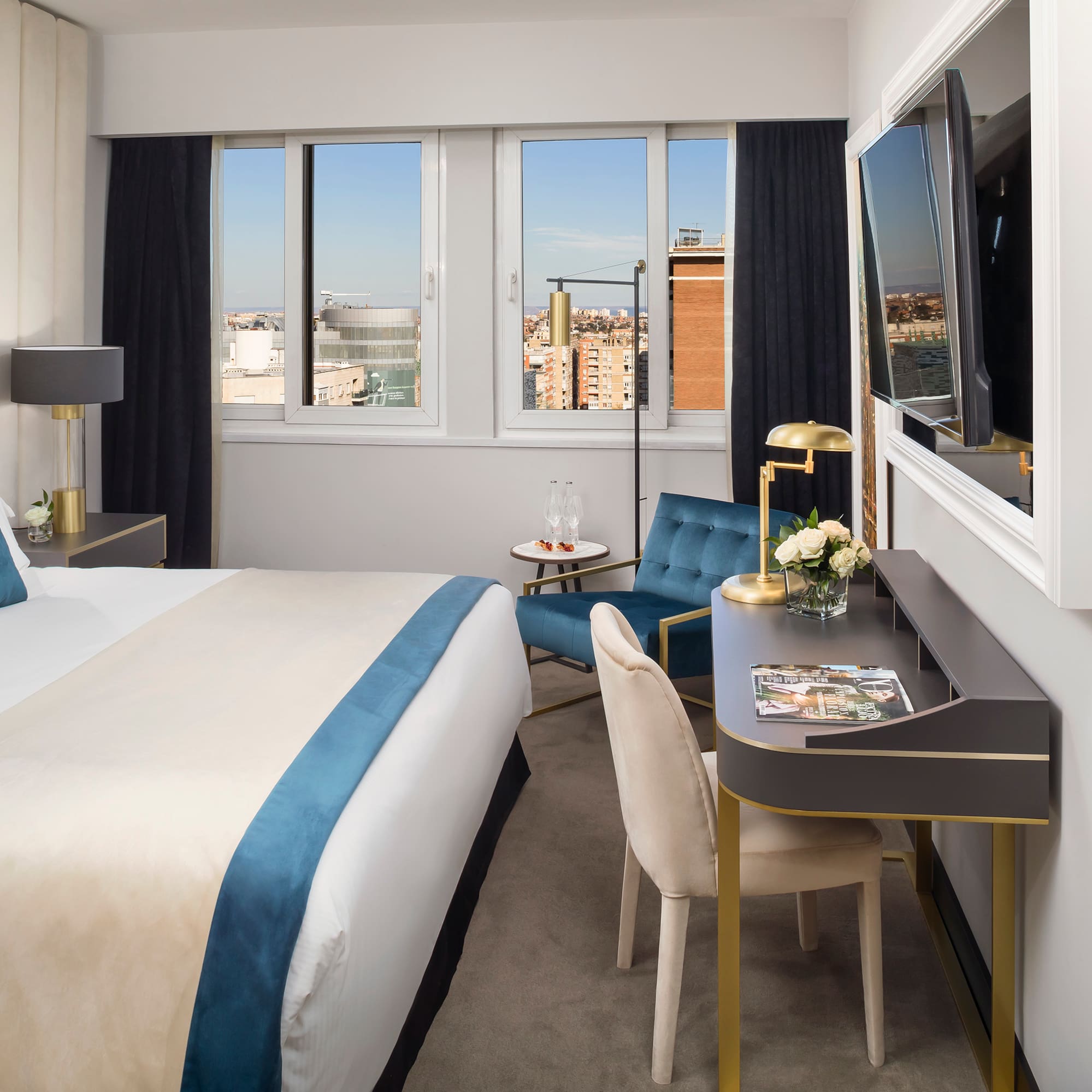 a room with a bed and a tv