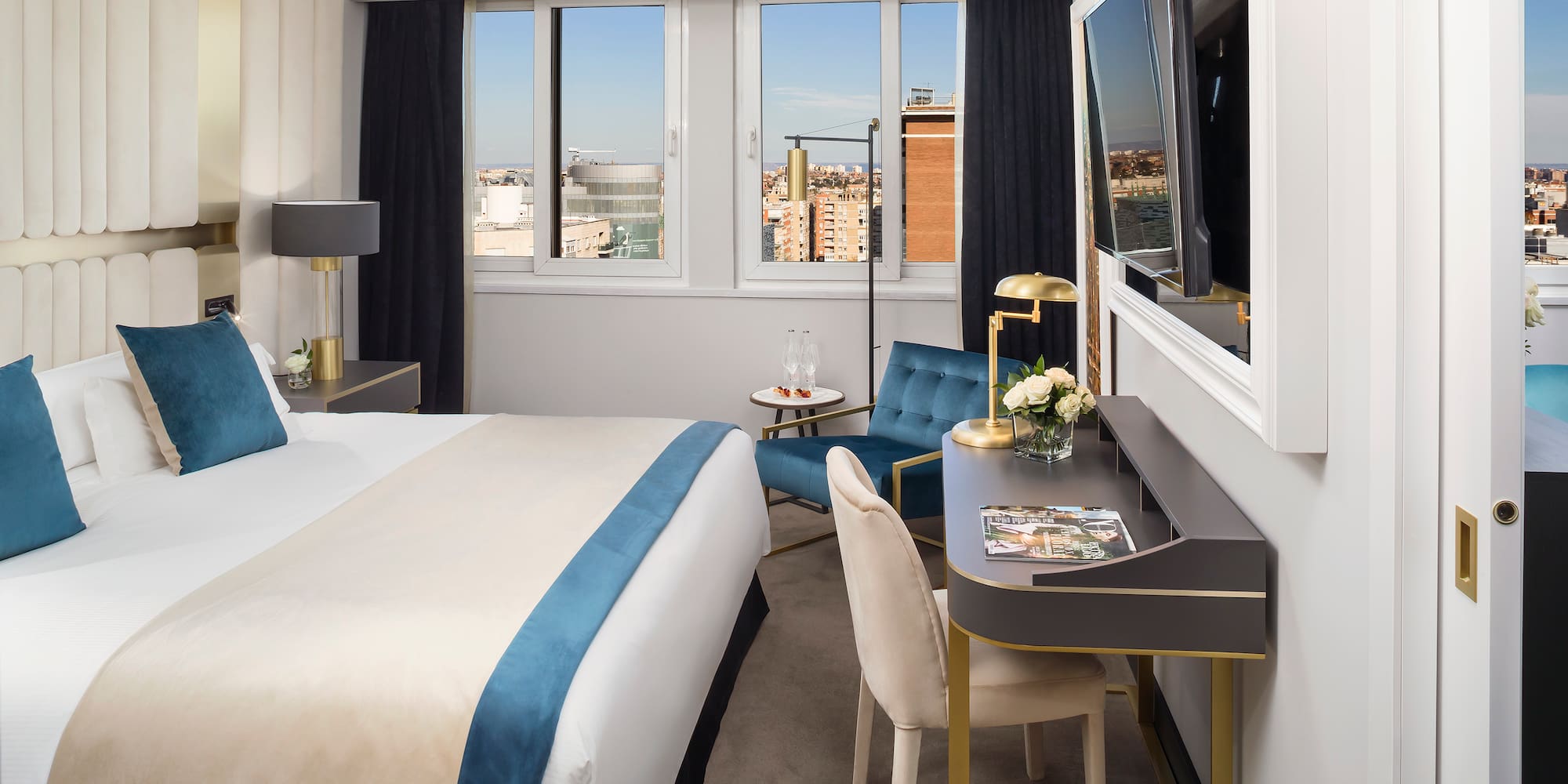 a room with a bed and a tv