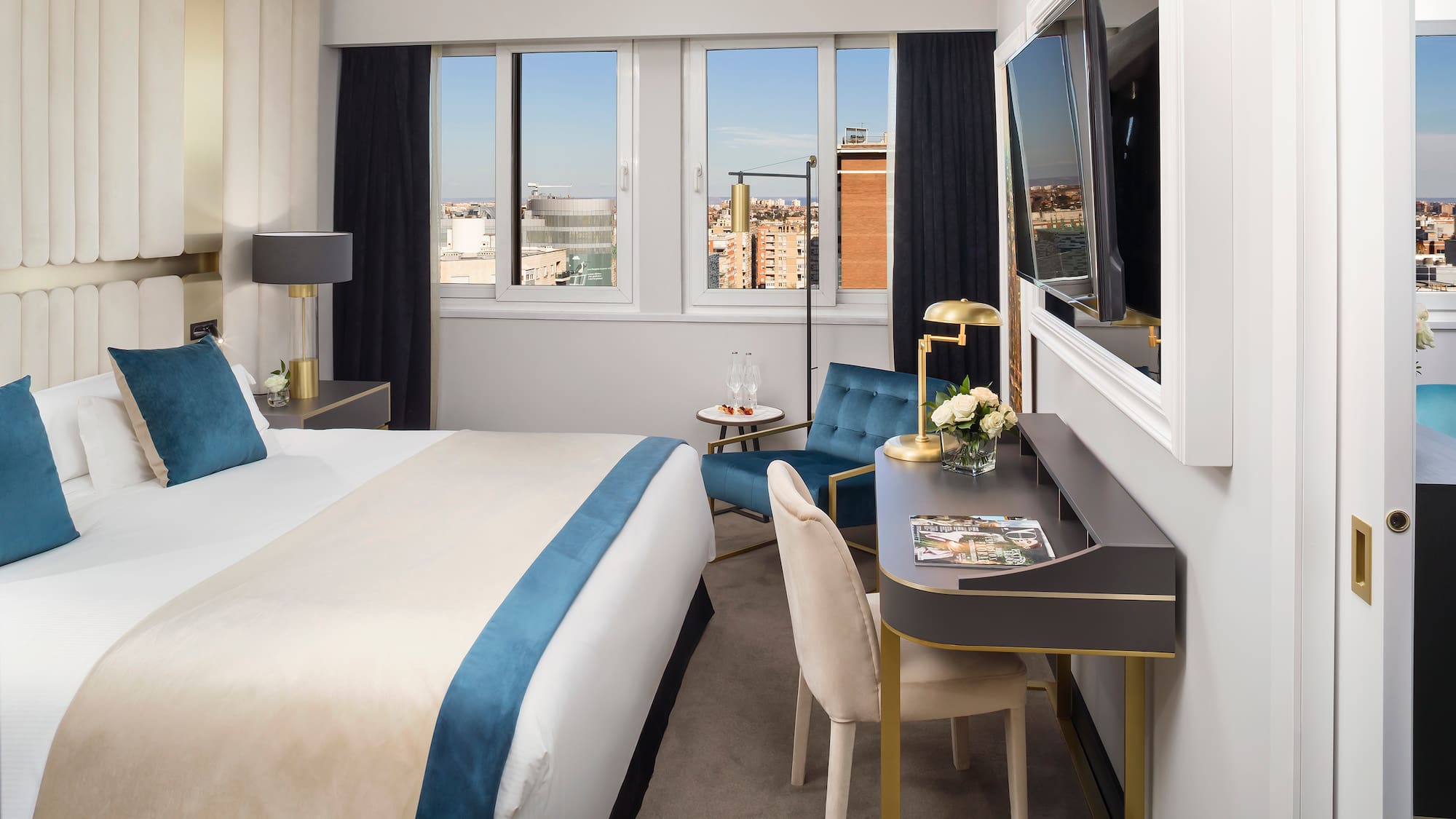 a room with a bed and a tv