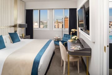 a room with a bed and a tv