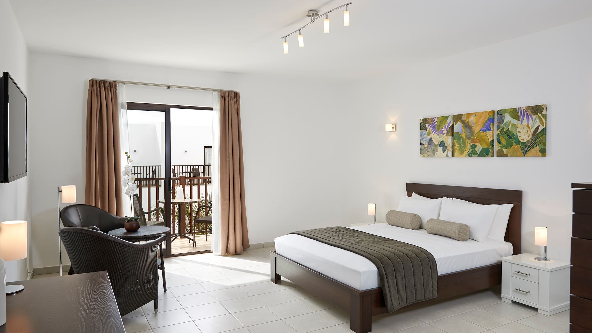 a bedroom with a bed and a chair