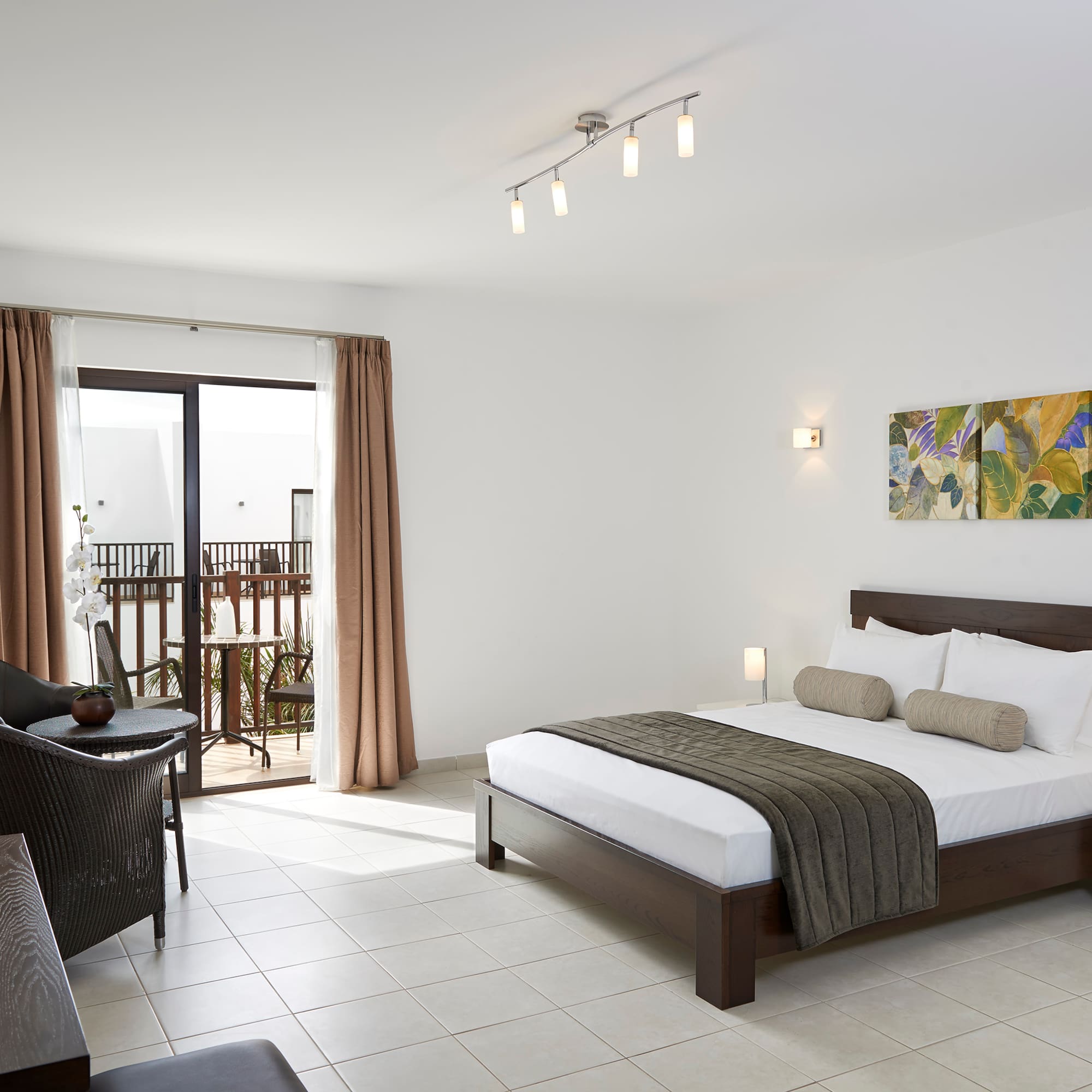 a bedroom with a bed and a chair