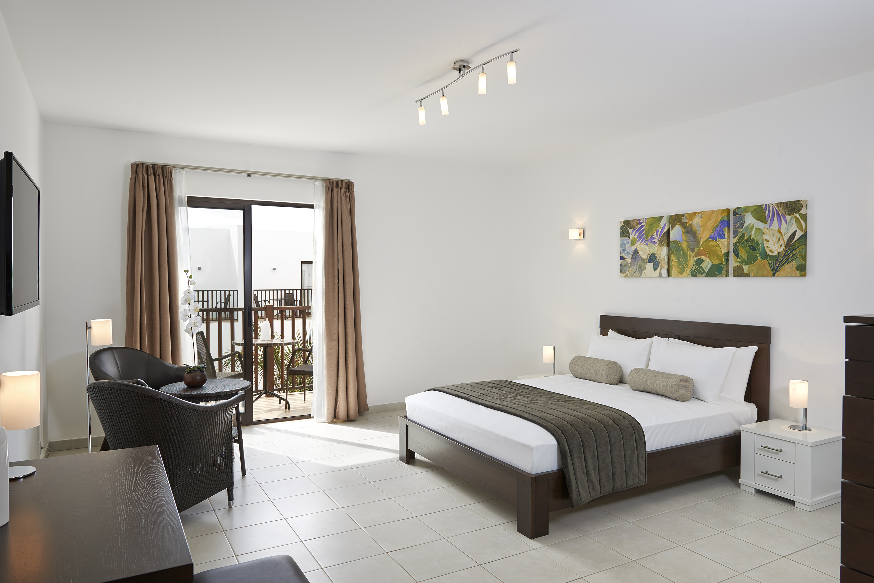 a bedroom with a bed and a chair
