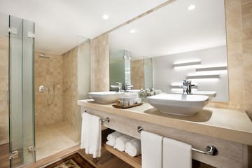 a bathroom with a shower and sink