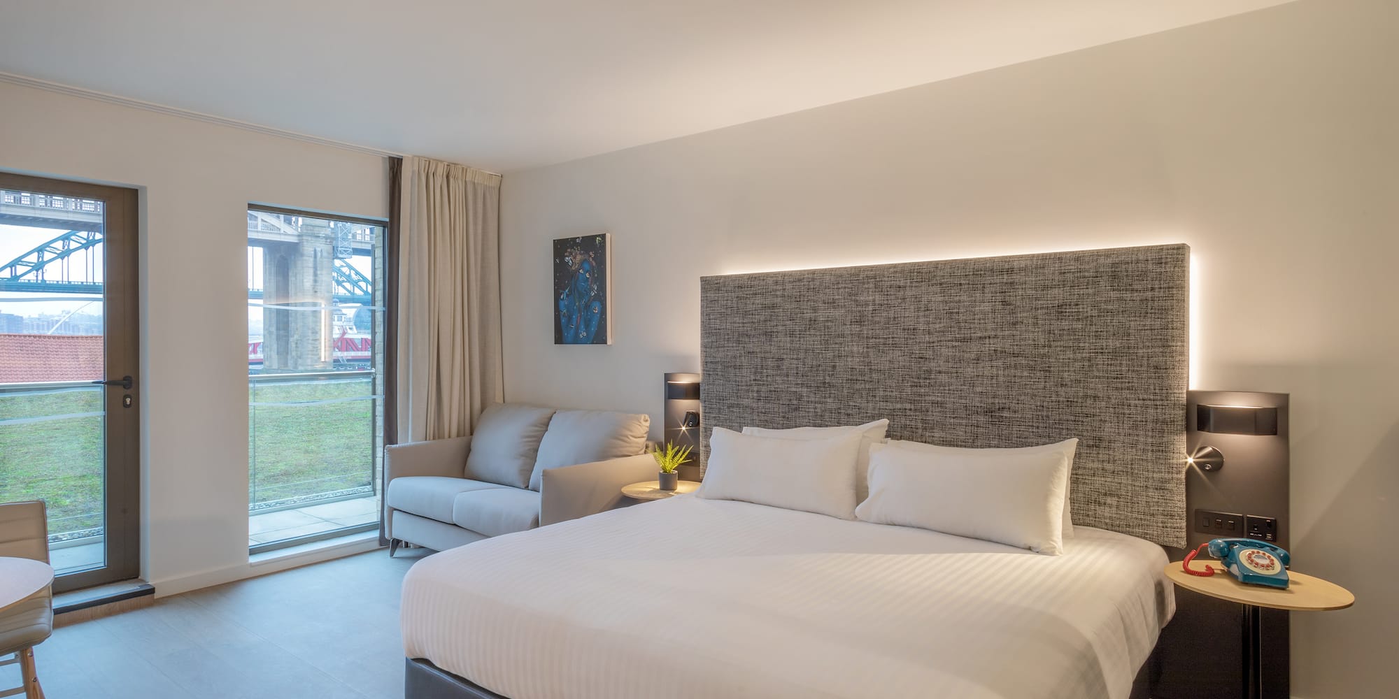 a bed and couch in a room