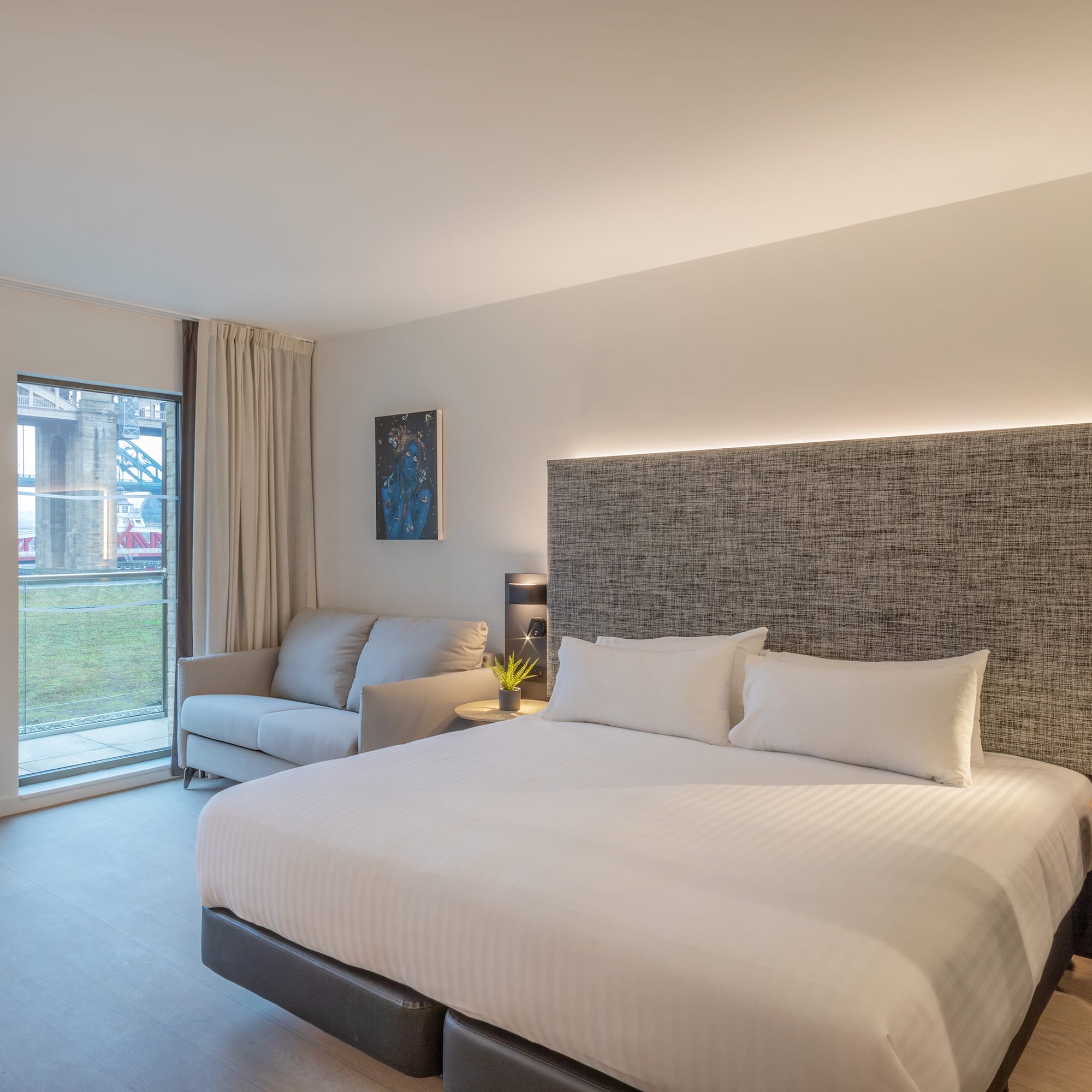 a bed and couch in a room