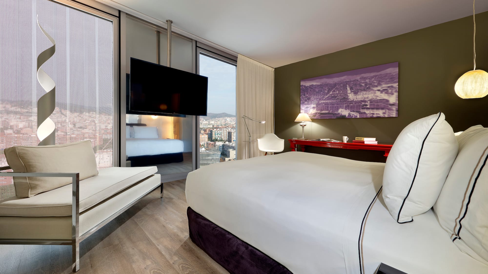 a room with a bed and a television